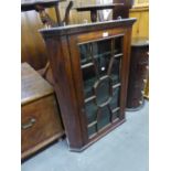 GEORGE III MAHOGANY FLAT FRONTED CORNER CUPBOARD, of typical form with dentil moulded cornice,