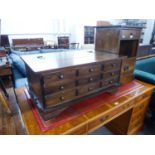 A LAURA ASHLEY 'GARRAT' DARKWOOD APOTHECARY COFFEE TABLE, HAVING NINE SMALL DRAWERS AND LIFT-UP TOP,