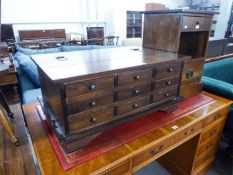 A LAURA ASHLEY 'GARRAT' DARKWOOD APOTHECARY COFFEE TABLE, HAVING NINE SMALL DRAWERS AND LIFT-UP TOP,