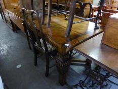 ELIZABETHAN STYLE MEDIUM OAK OBLONG DRAW-LEAF DINING TABLE WITH FLUTED FRIEZE, ON FOUR HEAVY