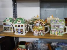 COLLECTION OF ELEVEN MODERN POTTERY NOVELTY TEAPOTS, including WADE and SADLER EXAMPLES, mainly