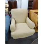 A GOOD QUALITY LARGE UPHOLSTERED ARMCHAIR, COVERED IN CREAM FABRIC (POSSIBLY LAURA ASHLEY)