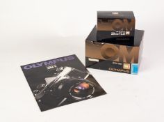 BOXED OLYMPUS OM-1 SLR ROLL FILM CAMERA BODY, together with a BOXED OLYMPUS MC AUTO-W f2.8, 28mm