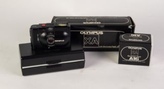 CASED OLYMPUS XA 35mm CAPSULE CAMERA, lacking original A11 electronic flash, together with an