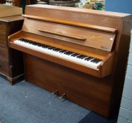 DANEMANN, TEAK CASED UPRIGHT PIANOFORTE, iron framed and overstrung, action stamped 'Schwander', 56"