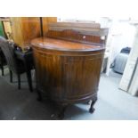 A GOOD QUALITY MAHOGANY DEMI-LUNE SINGLE DOOR CUPBOARD, RAISED ON CLAW AND BALL LEGS