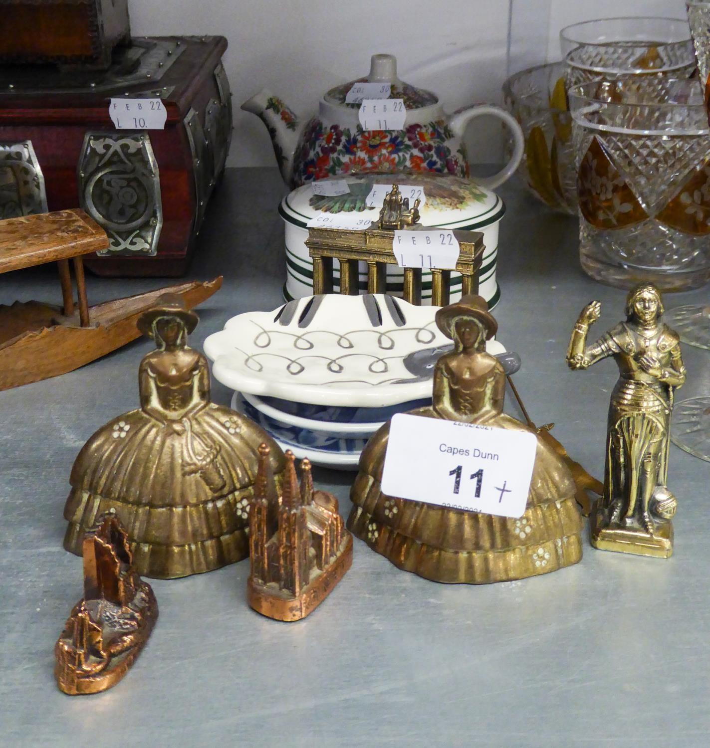 TWO BRASS CRINOLINE FIGURE TABLE BELLS AND EIGHT MINOR SOUVENIR ORNAMENTS; ASTBURY CHINA POMADE