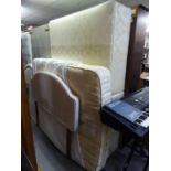 A DOUBLE DIVAN BED WITH SPRUNG EDGE BASE AND INTERIOR SPRING MATTRESS AND THE UPHOLSTERED HEADBOARD