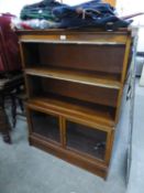 A PAIR OF TWENTIETH CENTURY WATERFALL OPEN BOOKCASES WITH GLASS PANELLED DOORS TO BASES OF GLOBE