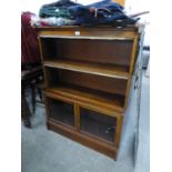 A PAIR OF TWENTIETH CENTURY WATERFALL OPEN BOOKCASES WITH GLASS PANELLED DOORS TO BASES OF GLOBE