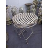 AN IRON SINGLE CHAIR AND CIRCULAR TOP BISTRO TABLE SET