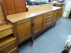 A G-PLAN 'FRESCO' TEAK LONG LOW SIDEBOARD, FOUR CENTRAL DRAWERS, FLANKED BY TWO CUPBOARD DOORS TO