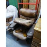 A BROWN HIDE COVERED REVOLVING EASY ARMCHAIR AND MATCHING STOOL