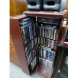 A CD/DVD CABINET WITH A LARGE SELECTION OF CD's AND DVD's