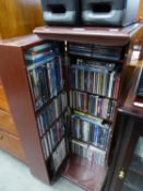 A CD/DVD CABINET WITH A LARGE SELECTION OF CD's AND DVD's