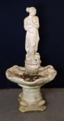 A LARGE ORNAMENTAL CONCRETE 'VENUS' ON CLAM SHELL GARDEN FOUNTAIN, RAISED ON A COLUMN STYLE BASE,