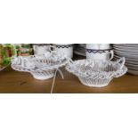 FLORAL ENCRUSTED PORCELAIN BASKET, of circular wire pattern with four upright loop handles to the