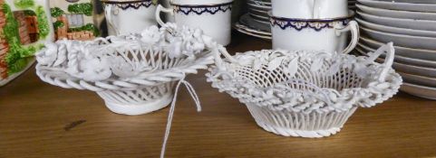 FLORAL ENCRUSTED PORCELAIN BASKET, of circular wire pattern with four upright loop handles to the