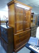 A VICTORIAN FLAME MAHOGANY LINEN PRESS, THE UPPER SECTION HAVING TWO PANEL DOORS, THE INTERIOR