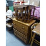PINE CHEST OF FOUR DRAWERS HAVING KNOB HANDLES AND AN OAK NEST OF THREE COFFEE TABLES