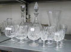 THREE VARIOUS CUT GLASS DECANTERS AND MISC DRINKING GLASSES AND TWO  VASES