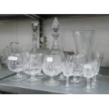 THREE VARIOUS CUT GLASS DECANTERS AND MISC DRINKING GLASSES AND TWO  VASES