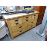 A MODERN SOLID LIGHT OAK SIDEBOARD, HAVING SIX SMALL DRAWERS ABOVE FOUR LARGER DRAWERS. 4'11" long x