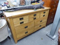 A MODERN SOLID LIGHT OAK SIDEBOARD, HAVING SIX SMALL DRAWERS ABOVE FOUR LARGER DRAWERS. 4'11" long x