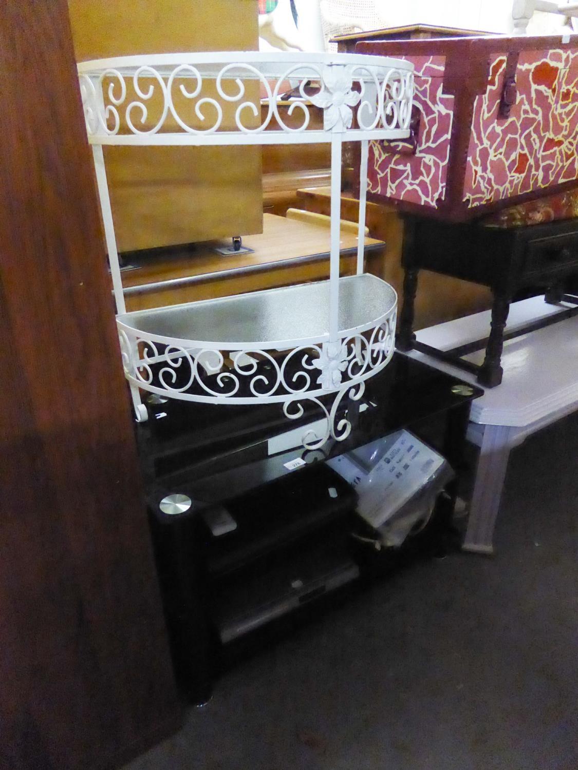 A BLACK GLASS THREE TIER TV STAND, A WHITE WROUGHT IRON HALL STAND WITH GLASS TOP AND A DVD
