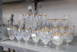TWO CUT GLASS DECANTERS AND STOPPERS,  A SET OF SIX CUT GLASS CORDIAL GLASSES WITH GILT RIMS; A