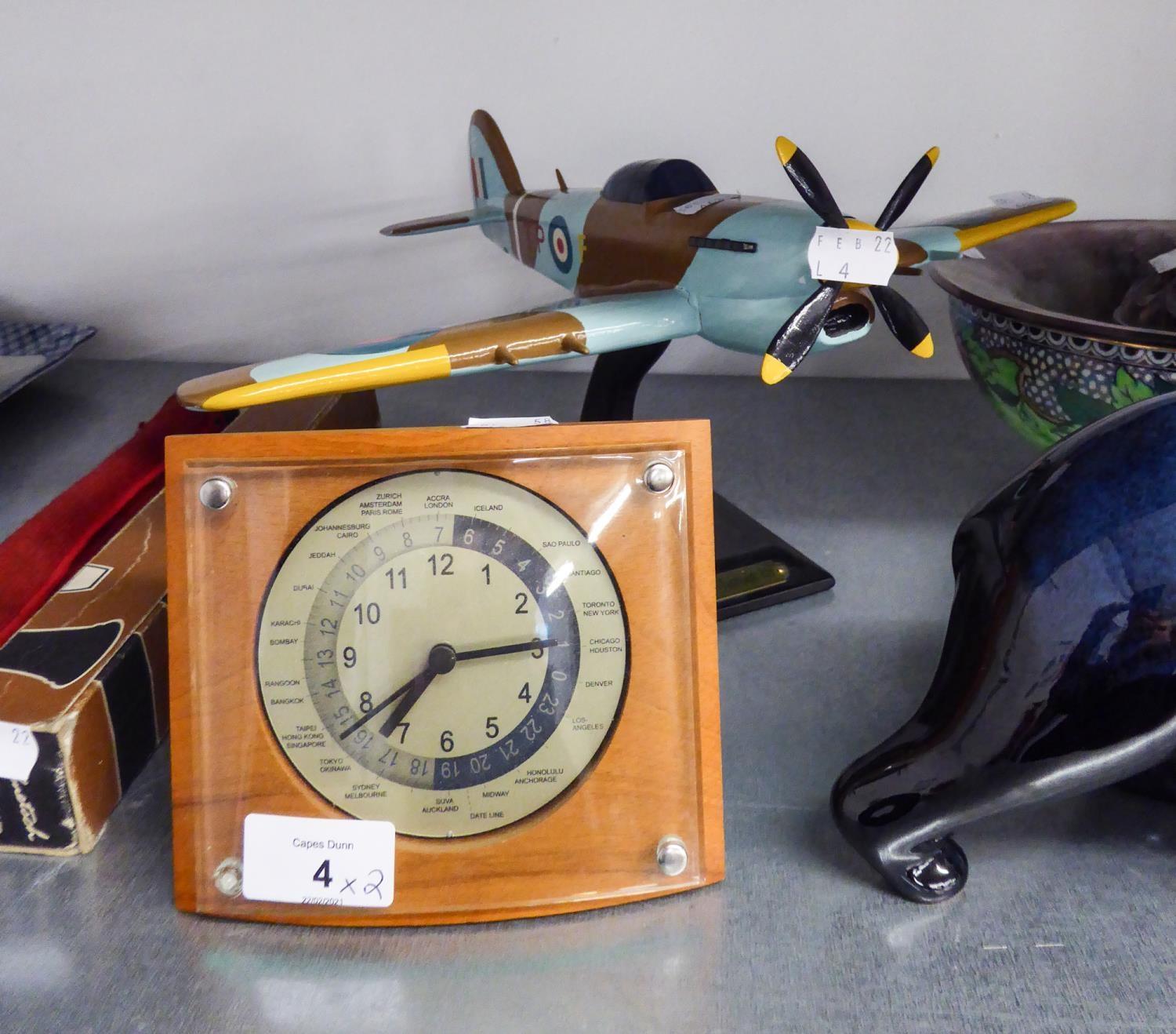 A MODEL OF A 'HAWKER TYPHOON' ON STAND AND A WORLD TIME MANTEL CLOCK (2)