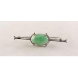 9ct WHITE GOLD BAR BROOCH set with cabochon oval green jade, 2 1/4in (5.75cm) wide, 4.4 gms