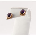 PAIR OF 9ct GOLD OVAL EARRINGS, each collet set with a faceted oval amethyst, 2.7gms