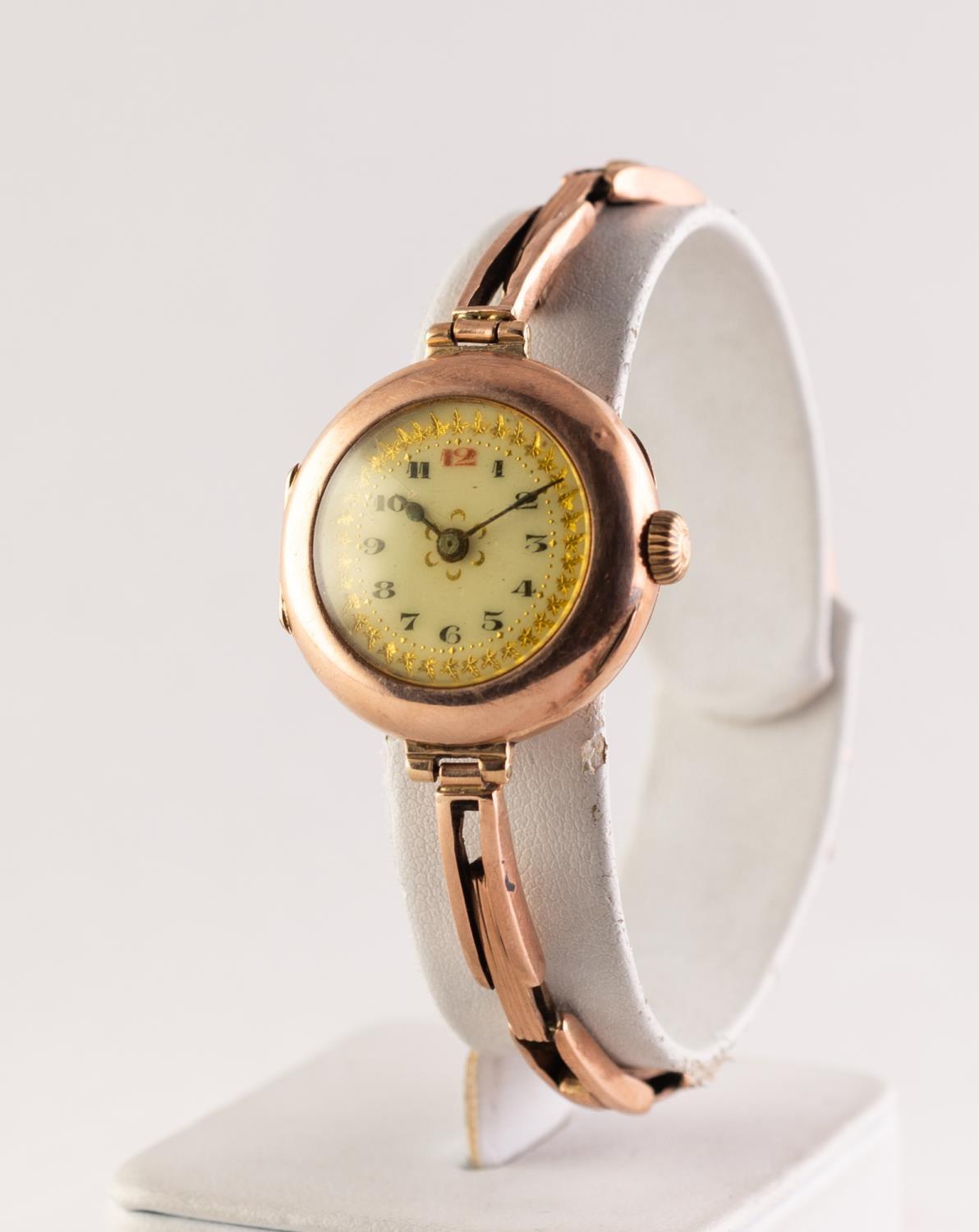 LADY'S 9ct GOLD VINTAGE WRISTWATCH with mechnical movement, decorated Arabic dial, circular case and