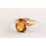 9ct GOLD DRESS RING with an oval citrine in a four claw setting, 3.8 gms, ring size R