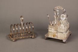 ELECTROPLATED FOUR DIVISION CRUET STAND, of square form with shell capped handle, nulled border