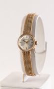 GARRARD OF LONDON, LADY'S 9ct GOLD WRISTWATCH with Swiss 15 jewels movement, small circular silvered