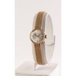 GARRARD OF LONDON, LADY'S 9ct GOLD WRISTWATCH with Swiss 15 jewels movement, small circular silvered