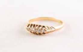 AN EDWARDIAN 18ct GOLD RING, with a lozenge shaped setting of five graduated small diamonds,