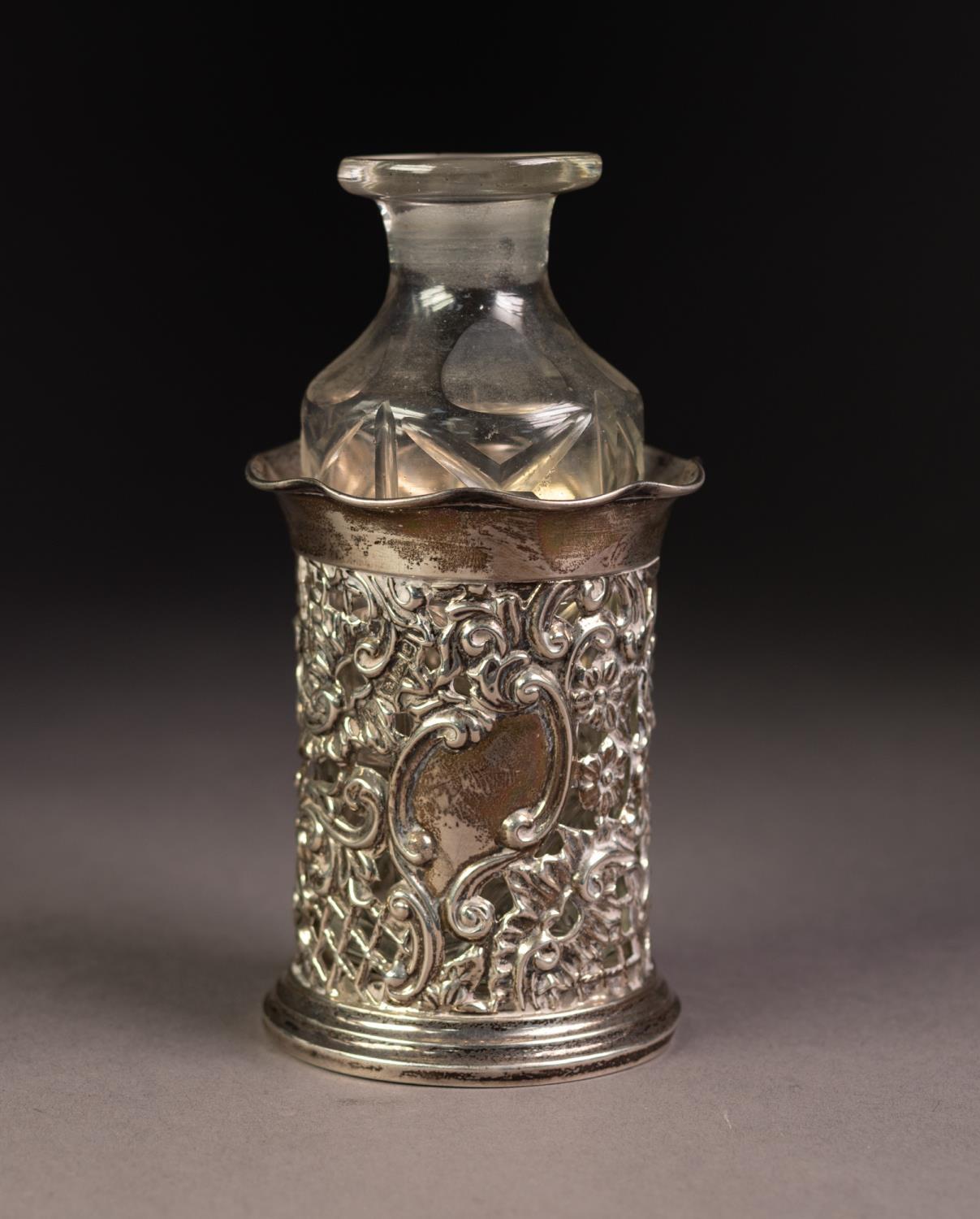 EDWARD VII PIERCED SILVER CYLINDRICAL BOTTLE HOLDER, with frilled rim and circular foot, 3 1/8? (