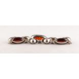 A SILVER NINE LINK BRACELET, three of the links set with cabochon oval amber, hook fastening