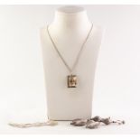 SILVER FINE CHAIN NECKLACE AND THE SILVER OBLONG OPENWORK PENDANT with floral centre; a silver