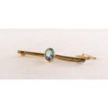 9ct GOLD BAR BROOCH, the centre collet set with an oval blue zircon, with safety chain, 2 1/2in (6.