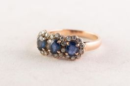 14ct GOLD, SAPPHIRE AND DIAMOND TRIPLE CLUSTER RING set with three oval sapphires surrounded by