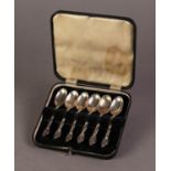 CASED SET OF SIX ELECTROPLATED TEA SPOONS with fancy handles, together with a QUANTITY OF LOOSE