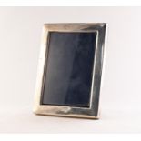 MODERN SILVER FRONTED DESK TOP PHOTOGRAPH FRAME, of plain oblong form with blue plush lined easel