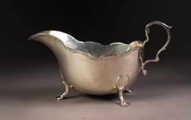 GEORGE VI SILVER SAUCE BOAT, of typical form with high scroll handle, moulded border and stepped