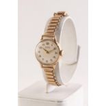 BUREN GRAND PRIX LADY'S 9ct GOLD WRISTWATCH with mechanical movement, circular silvered Arabic dial,