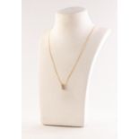 9ct GOLD FINE CHAIN NECKLACE AND SMALL PENDANT with a round, brilliant cut solitaire diamond in a