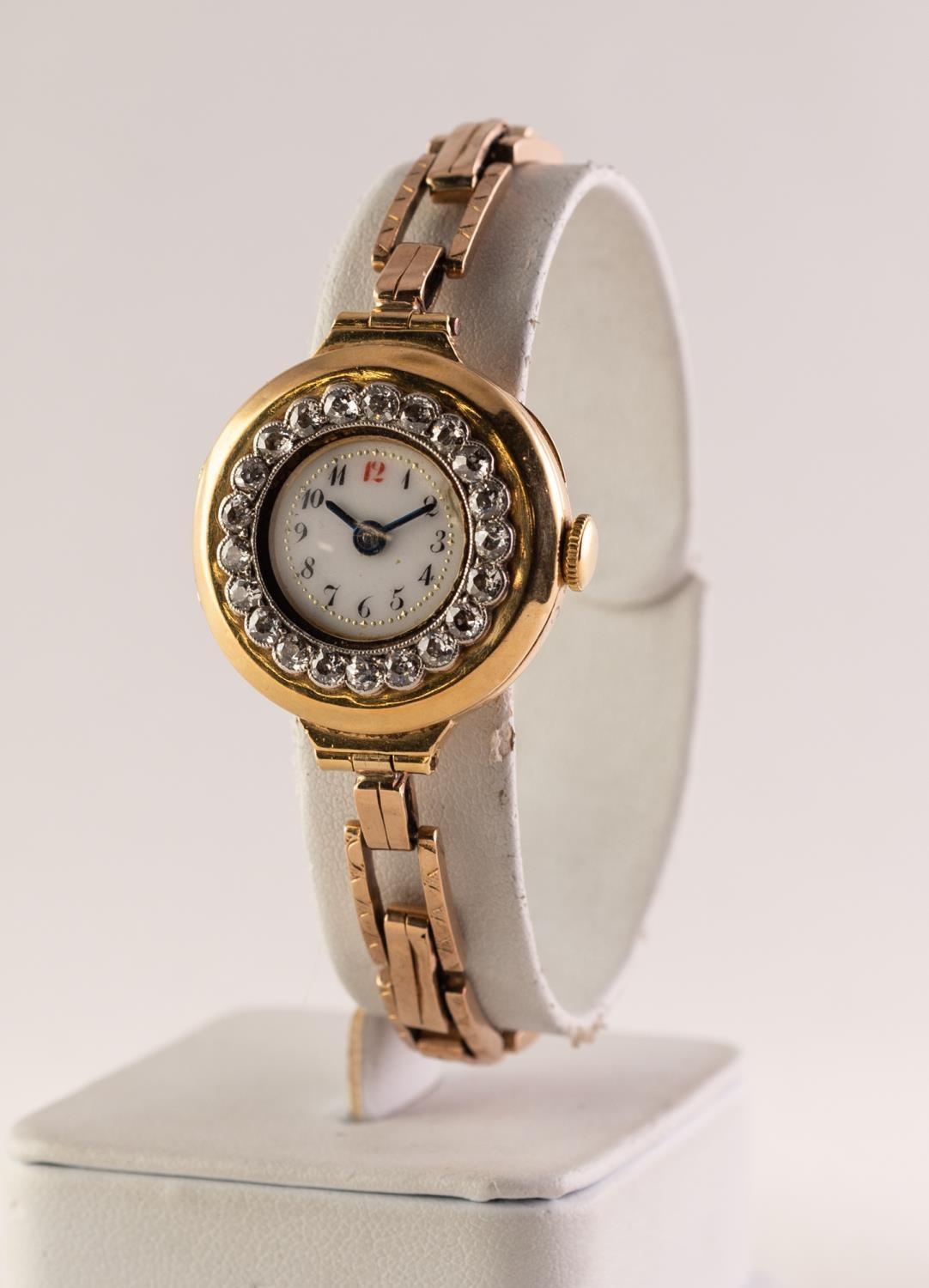 EARLY 20th CENTURY 18ct GOLD CASED LADY'S WRISTWATCH with 15 jewel movement, the besel set with 21